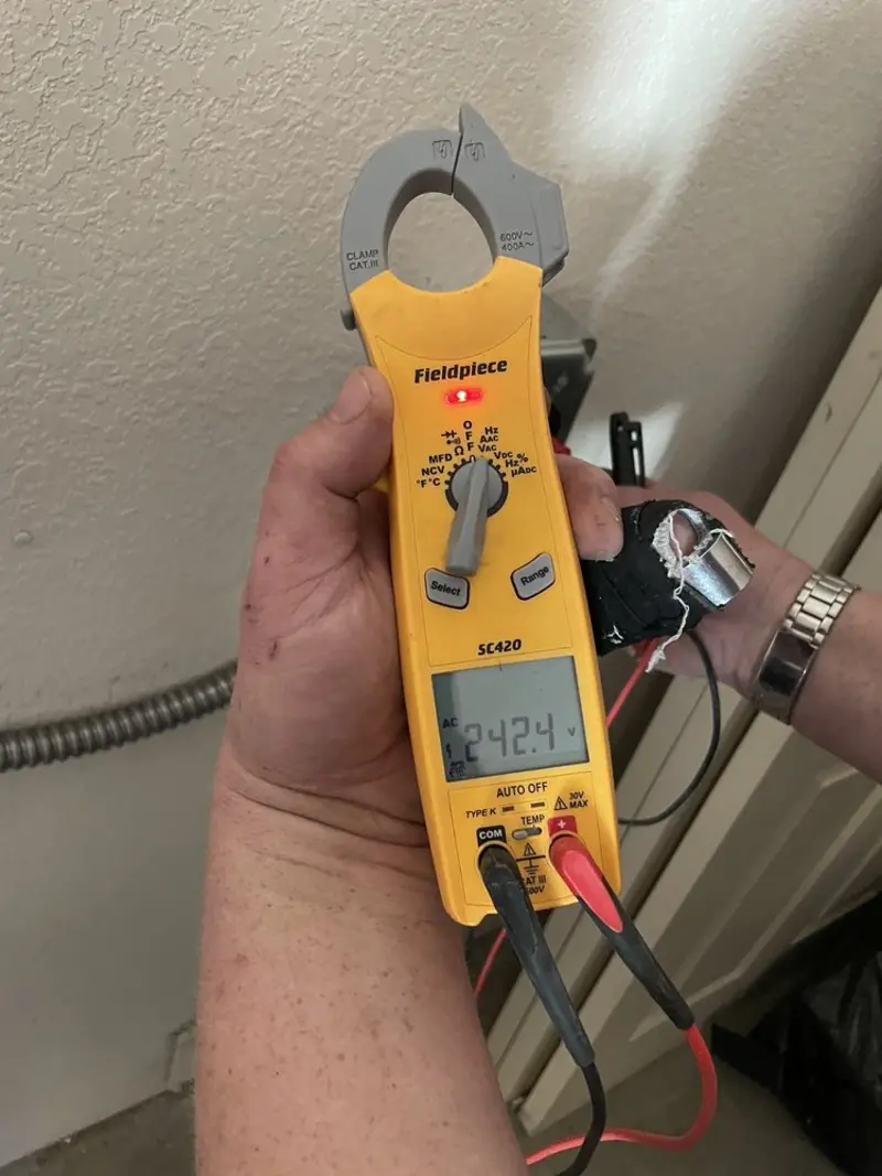 Voltage testing with clamp meter during Generator Installation in Fish Hawk